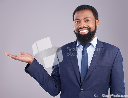 Image of Portrait, black man and product placement for business in studio isolated on a gray background. Marketing, mockup and smile of happy African professional with branding, advertising or mock up space.