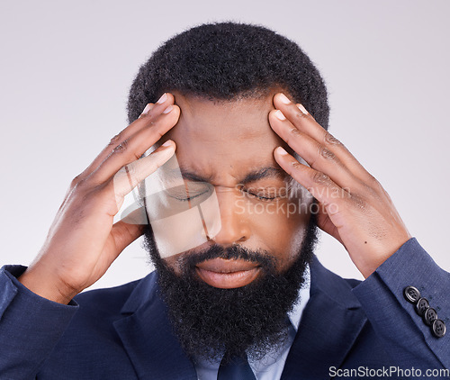 Image of Business, headache and black man in studio of anxiety, debt and frustrated for stock market crash. Corporate male, face and stress in pain, burnout and bankruptcy of financial crisis, risk or problem