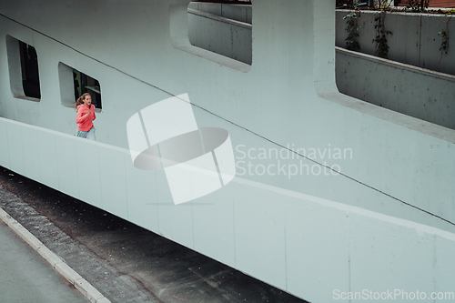 Image of Women in sports clothes running in a modern urban environment. The concept of a sporty and healthy lifestyle