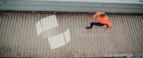 Image of Top view photo of omen in sports clothes running in a modern urban environment. The concept of a sporty and healthy lifestyle