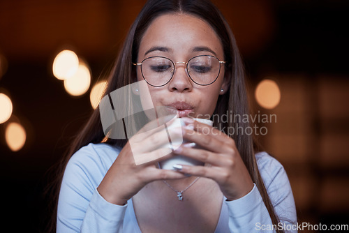 Image of Cafe, coffee and woman blow on warm tea cup, hot chocolate or espresso drink in retail shop, store or restaurant. Commerce service, relax and young thirsty person blowing cool air on latte beverage