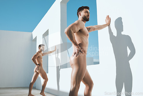 Image of Art, body and posing nude men in sun, shadow and leaning on wall together in creative architecture. Pride, power and light, gay model in athletic Greek statue pose, freedom in lgbt self expression.