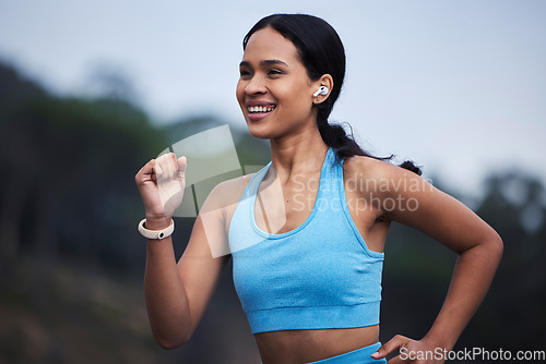 Image of Runner fitness, woman and nature fog in cardio challenge, morning exercise goals and fast energy for progress. Training, workout and happy running of person jogging and listening to music outdoor