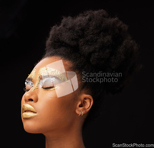 Image of Beauty, gold and glow with black woman and makeup in studio for luxury, cosmetics or African pride. Natural, creative and goddess with female model on background for queen, bronze and glamour