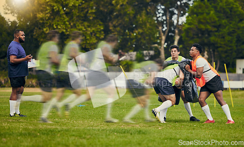 Image of Rugby men, running or sports sequence on field for game practice or match training for team goals. Speed of athlete players in strong tackle on pitch for gaming event outdoor in action or motion blur