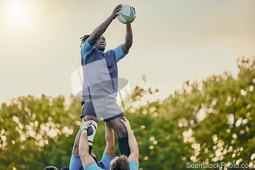 Image of Sports, men and rugby and jump with team on field, playing game with energy and fitness, ball and action outdoor. Training, exercise and professional match, sport club with male group and active