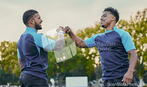 Image of Sport, athlete men and fist bump on field for rugby teamwork, winning and success at game. Team building, happiness and support for sports friends, goals and winner to celebrate achievement together