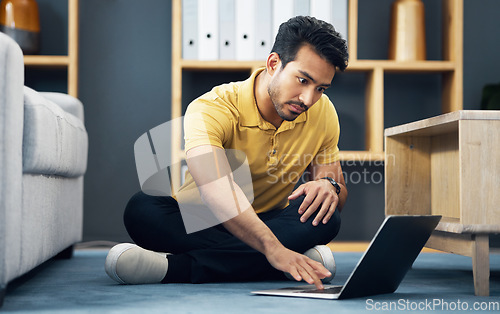 Image of Remote work, typing and an Asian man with a laptop on the floor for entrepreneurship and freelancing. Serious, contact and an entrepreneur working on a computer, reading communication and an email