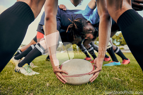 Image of Sport, rugby ball and team on field, men playing game with energy and fitness with huddle together. Teamwork, scrum and ready for professional match, male sports club and outdoor with exercise