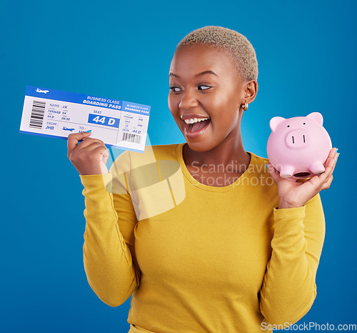 Image of Piggy bank, travel ticket and black woman with saving on blue studio for flight, boarding passport and investment. Traveling mockup, money and excited girl for immigration, holiday or global vacation