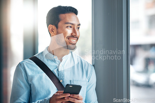 Image of Happy, thinking and an Asian man with a phone for social media, communication and chat. Business, idea and a Chinese employee typing on a mobile app, replying to a message or work email online