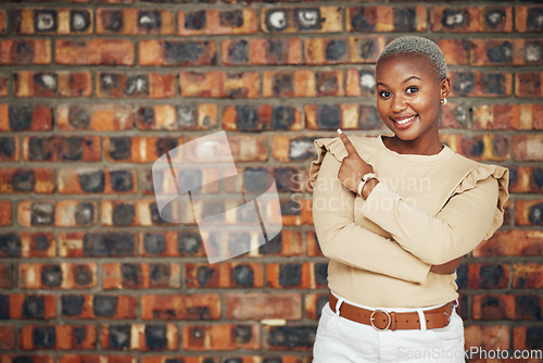 Image of Pointing, mockup and portrait of black woman and brick wall background for announcement, product placement and offer. Idea, news and deal with female and gesture for information, opportunity and show