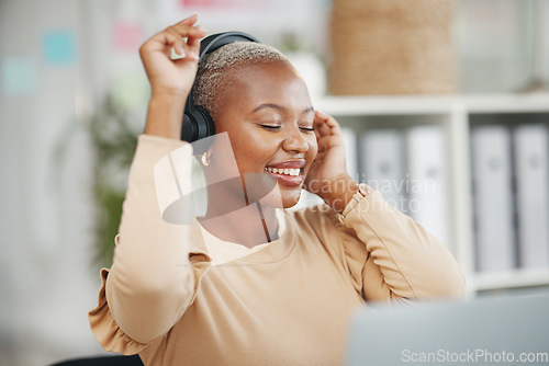 Image of Dance, enjoying and black woman with music during work, radio break and listening to audio. Smile, stress relief and dancing African employee with headphones for streaming podcast, songs and playlist