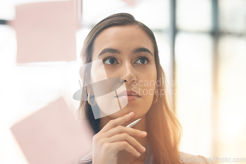 Image of Face, office brainstorming and woman thinking of notes for research, agenda and mindmap at window. Serious female employee at glass for ideas of solution, strategy and planning vision of target goals