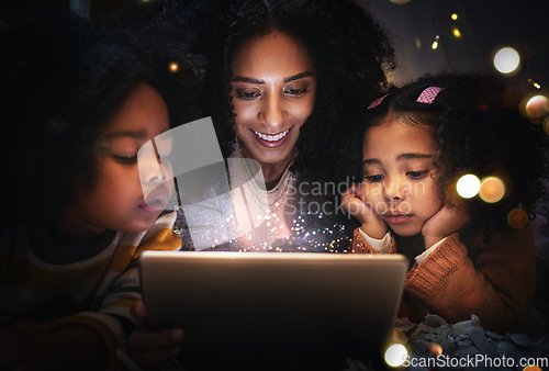 Image of Tablet, night a woman reading to her children in a tent while camping in the bedroom of their home together. Black family, story or kids with a mother storytelling to her kids at bedtime for bonding