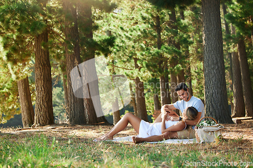 Image of Couple on picnic, nature park and relax together outdoor, support and comfort with love and care while bonding. Summer, holiday with man and woman cuddle, happiness and relationship with trust