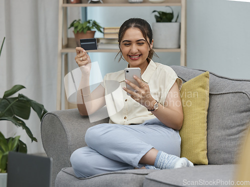 Image of Woman, credit card and cellphone for online shopping in home with digital payment, fintech or money transfer. Happy female person, mobile banking and finance for web sales, password and financial app