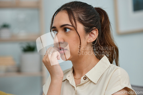 Image of Biting, nails and woman with anxiety, stress and mental health risk at home. Scared, fear and face of nervous female person bite nail in panic, worry and thinking of depression, problem and bad habit