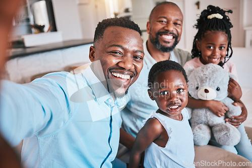 Image of Black family, selfie and father on a couch with children on a couch or sofa bonding, smile and happy in a home. African, grandfather and dad relax with kids as love, care and support in living room