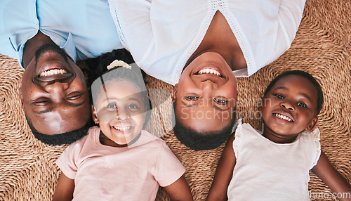 Image of Above, parents or portrait of happy kids on floor in house or home bonding or playing as a black family. Faces, mother or African father relaxing with kids, girls or siblings with smile, care or love