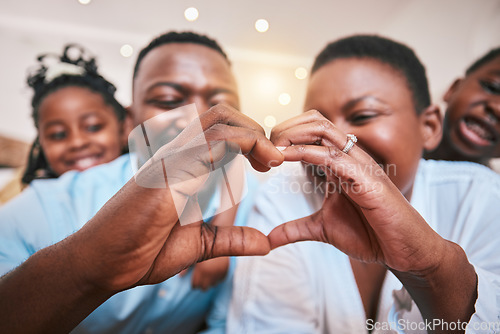 Image of Hands in heart, family and parent with children in home with gesture for love, support and care. Emoji, happy kids and closeup of African mom and dad with shape for bonding and healthy relationship