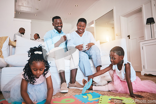 Image of Playing, parents and children relax in living room for bonding, quality time and child development. Happy family, home and mother, father and kids on floor having fun with toys for learning and games