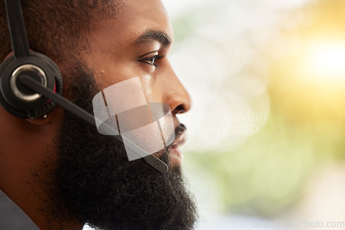 Image of Face, profile of black man and call center, headset with mic and customer service employee, CRM and mockup space. Male consultant at help desk job, flare and serious for contact us and tech support