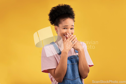 Image of Laughing, funny and portrait of woman with wow reaction to news isolated in a yellow studio background. Comedy, comic and happy young female person covering mouth due to crazy gossip energy or meme