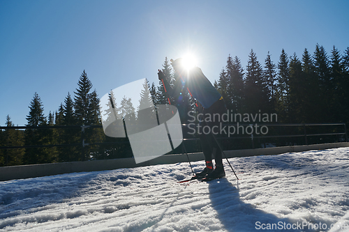 Image of Nordic skiing or Cross-country skiing classic technique practiced by man in a beautiful panoramic trail at morning.Selective focus.