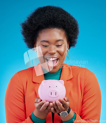 Image of Woman, piggy bank and wow for savings, financial investment and profit, increase or budget success. Excited african person with banking goals, finance safe and container on a blue, studio background