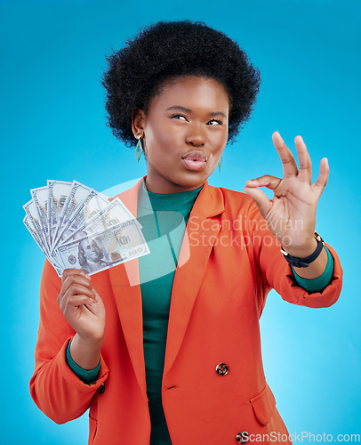 Image of Money, okay sign and woman thinking of success, profit and sales deal with yes emoji on blue background. Financial ideas of rich, african person for cash, lottery goals or bonus achievement in studio