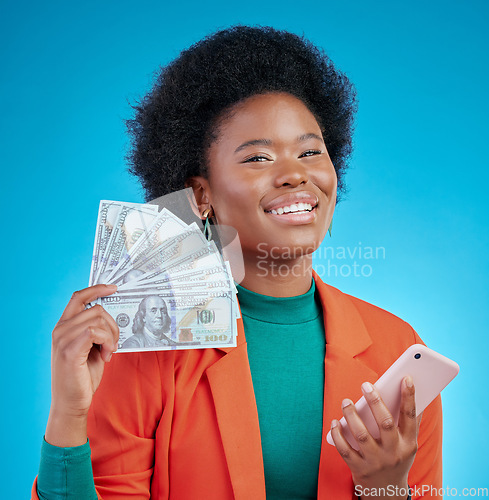 Image of Money fan, phone and woman in portrait winning, finance or online savings, profit and cash prize. Success, bonus and winner or african person on mobile, cashback and banking on blue studio background