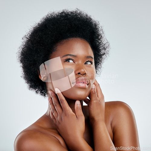 Image of Face, skincare and beauty of black woman, touch and isolated in studio on a white background. Serious, natural and African model with cosmetics, facial treatment and aesthetic, wellness and health