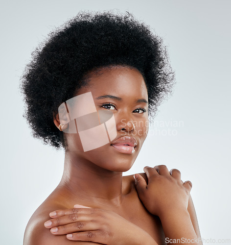 Image of Face, skincare and beauty of black woman, confident and isolated in studio on a white background. Serious, portrait and natural model with cosmetics, facial treatment or aesthetic, wellness or health