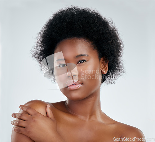 Image of Skincare, face and beauty of black woman, serious and isolated in studio on white background. Confident, portrait and natural model with cosmetics, facial treatment or aesthetic, wellness and health