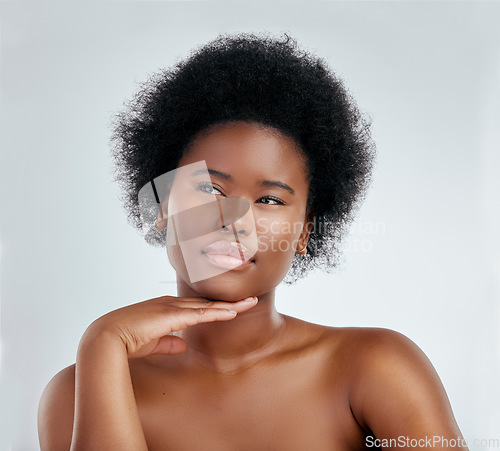 Image of Face, beauty and skincare of black woman, serious and isolated in studio on white background. Confident, hand or natural African model with cosmetic, facial treatment or aesthetic, wellness or health