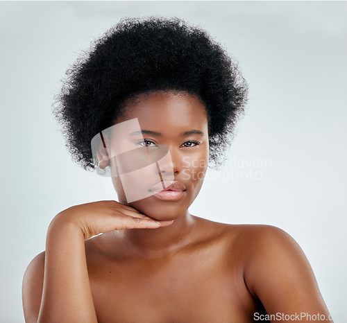 Image of Face, beauty and skincare of black woman with hand in studio isolated on a white background. Portrait, serious and natural model with cosmetics, facial treatment or aesthetic, wellness and confident