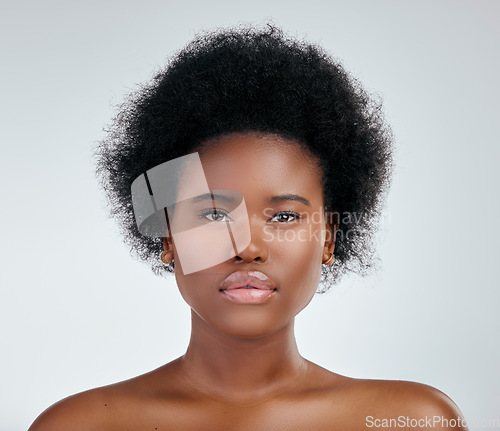 Image of Face, skincare and beauty of black woman in studio isolated on a white background. Portrait, serious and natural African model with cosmetics, spa facial treatment and aesthetic, wellness or health