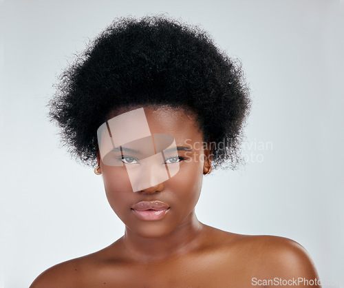 Image of Face, skincare and serious black woman in studio isolated on a white background. Portrait, beauty and natural African model with cosmetics, spa facial treatment and aesthetic, wellness or skin health