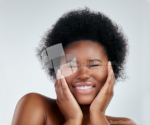 Image of Skincare, portrait and African woman in studio with a natural, wellness or cosmetic face routine. Health, young and headshot of a female model with facial dermatology treatment by a gray background.