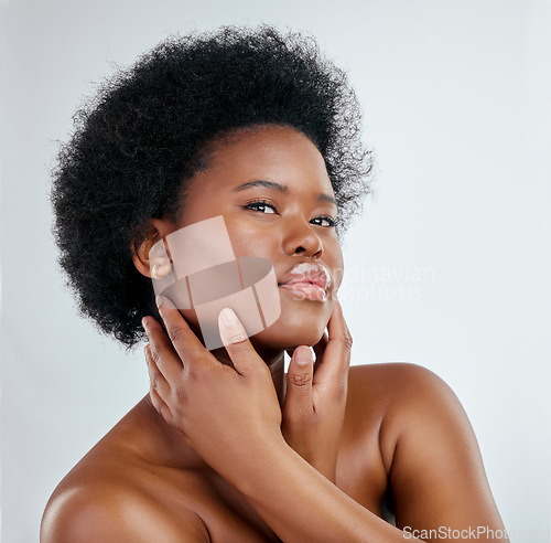 Image of Beauty, afro and black woman in portrait with skincare or cosmetics in studio background. Dermatology, hand and face african girl with natural hair for treatment with shine for wellness in mock up.