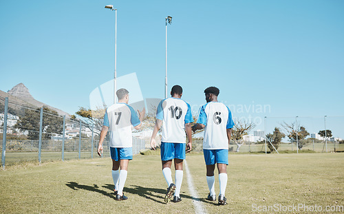 Image of Soccer, team and walking on field with back or conversation at training or competition in out with grass. Fitness, teamwork and stadium with football player after game or collaboration at club.