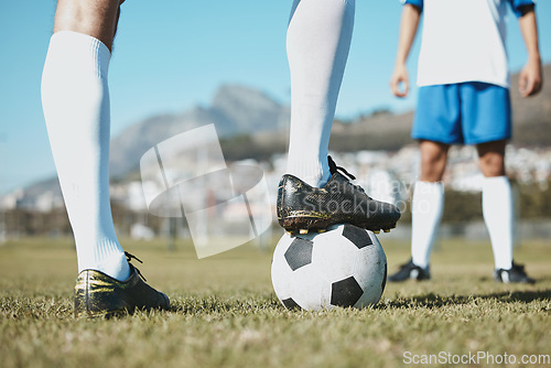 Image of Soccer, legs and foot on ball for match, game or start on the green grass field in nature outdoors. Feet of sports player on football for competition, beginning or getting ready in sport tournament