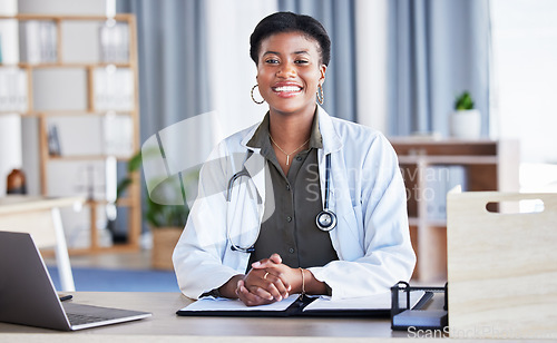 Image of Black woman, portrait and doctor in office for medical services, advice and consulting in clinic. Happy female therapist, healthcare worker and consultant at desk in hospital for wellness management