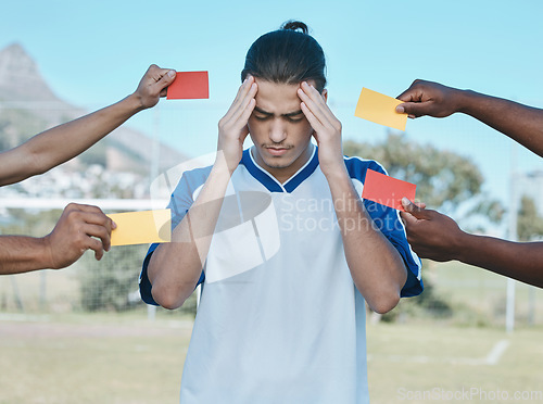 Image of Hands, card and man with stress from soccer, training headache and warning on the field. Sports, burnout and frustrated athlete with anxiety during a football game with a red and yellow referee fail