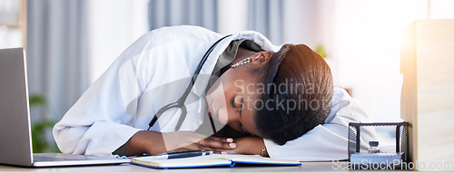 Image of Tired doctor, woman and sleeping on desk in clinic office with stress, rest and dream in workplace. Overworked medic, fatigue and burnout in hospital, table and break for mental health in wellness