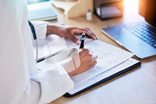 Image of Doctor hands, book and writing at desk, documents or review for report, results or ideas for healthcare. Medic, notebook and pen for paperwork, compliance and insurance info with schedule in hospital