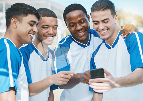 Image of Happy man, friends and soccer team with phone for social media, communication or online browsing outdoors. Group of football players smile on mobile smartphone app together after workout practice
