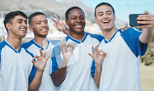 Image of Men in selfie, OK hand sign and soccer competition, sports and athlete group on field, diversity and emoji. Happy, young male football player and team smile in picture, gesture and social media post