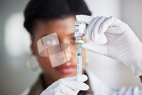 Image of Vaccine vial, needle and doctor for safety, healthcare and pharmaceutical medicine. Closeup, hands of woman and prepare vaccination, virus injection and bottle for immunity, medical drugs or smallpox
